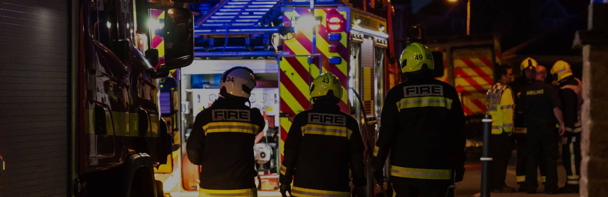 Group of firefighters and fire engines in Chester city centre