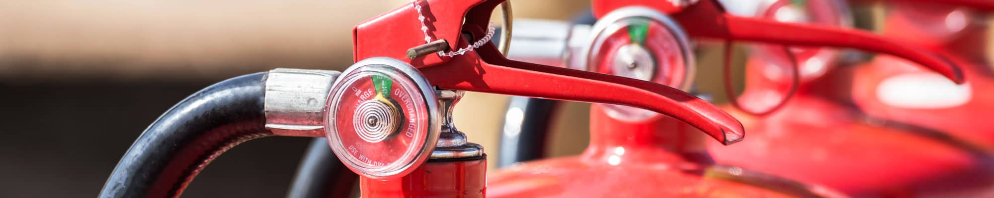 Row of fire extinguishers at commercial unit in Chester